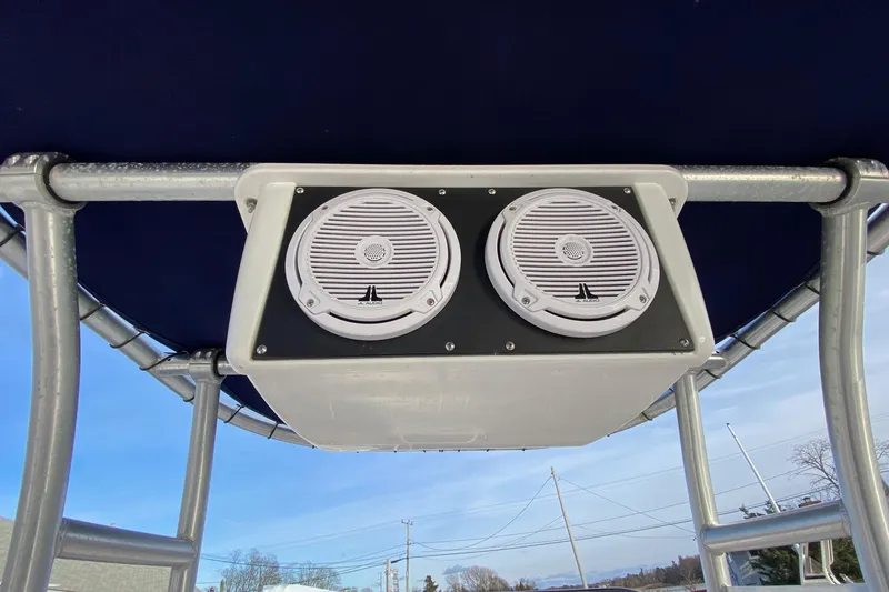 Slide: The Image of Speakers mounted on a 2001 Grady-White Escape 209 boat's T-top frame. - 6