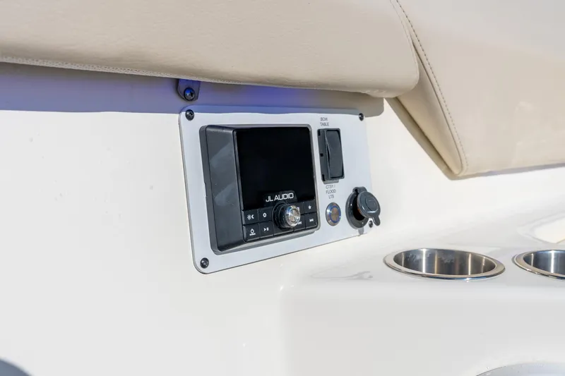 Slide: The Image of 2024 Boston Whaler 420 Outrage audio system with JL Audio controls and cup holders. - 30