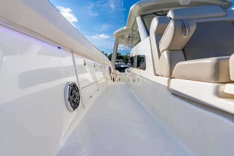 Slide: The Image of 2024 Boston Whaler 420 Outrage boat interior with luxurious seating and sleek design. - 31
