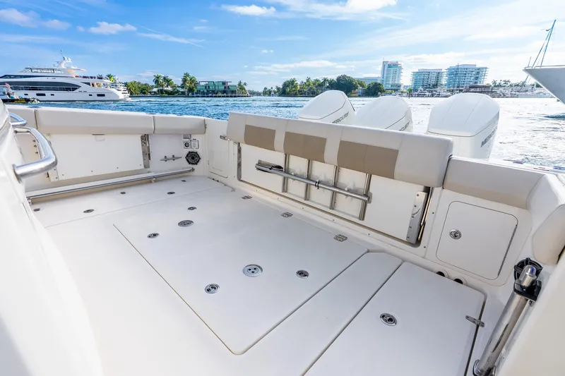 Slide: The Image of 2024 Boston Whaler 420 Outrage boat deck with seating and ocean view. - 39