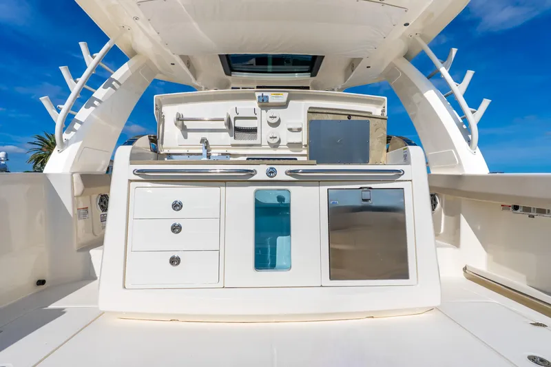 Slide: The Image of 2024 Boston Whaler 420 Outrage boat interior with sleek cabinetry and modern amenities. - 49