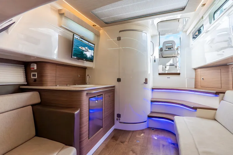 Slide: The Image of Luxurious interior of 2024 Boston Whaler 420 Outrage with modern amenities and elegant design. - 51