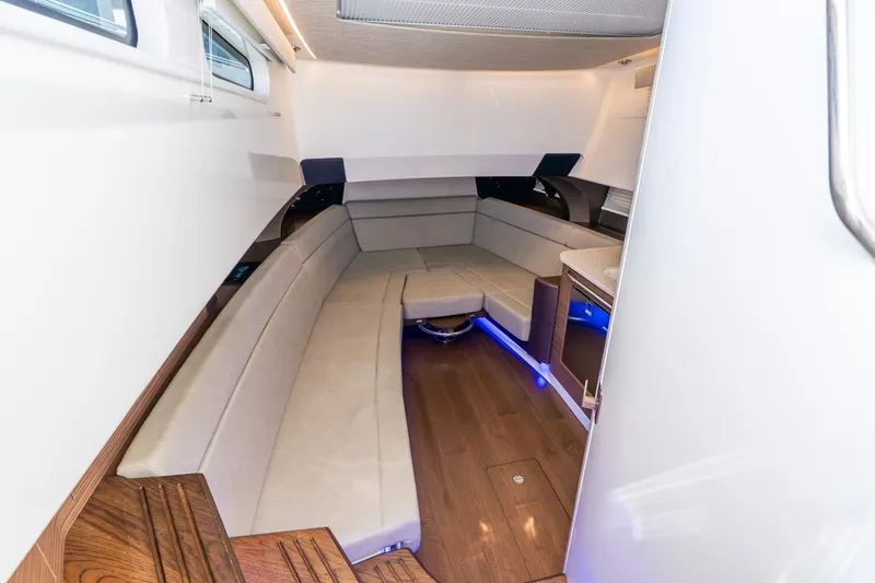 Slide: The Image of Luxurious interior of 2024 Boston Whaler 420 Outrage with elegant seating and ambient lighting. - 55
