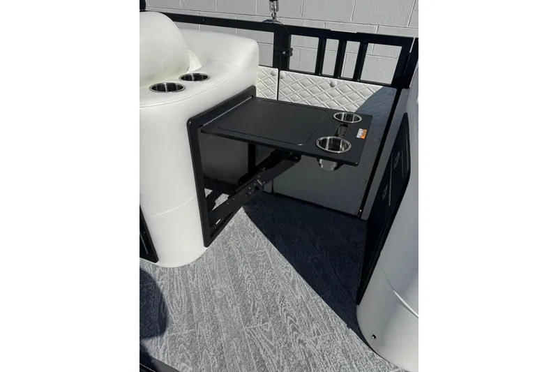 Slide: The Image of 2026 JC 24 SportToon TT interior with white seating and cup holders. - 14
