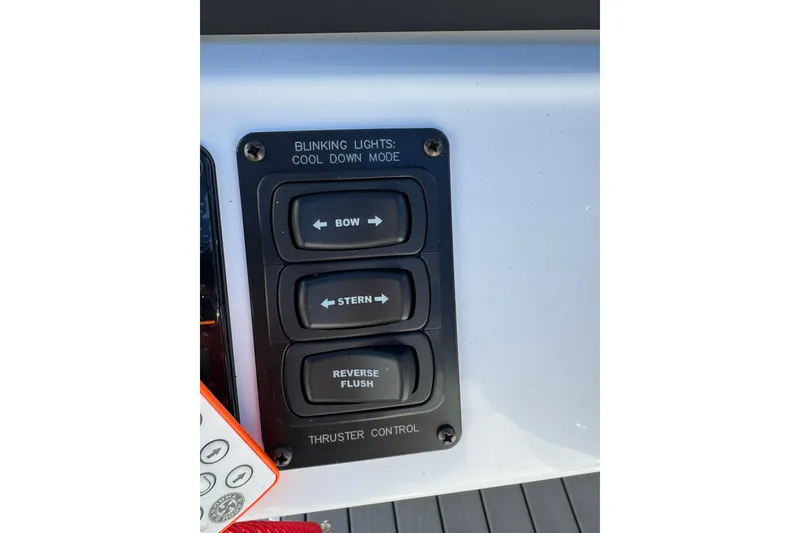 Slide: The Image of Control panel of 2026 JC 24 SportToon TT with bow, stern, reverse buttons. - 18