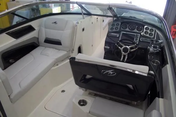 Slide: The Image of 2015 Monterey 328SS Super Sport boat on trailer, parked outdoors. - 2