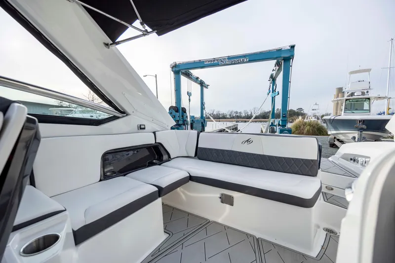 Slide: The Image of 2015 Monterey 328SS Super Sport boat interior with modern seating and sleek design. - 21