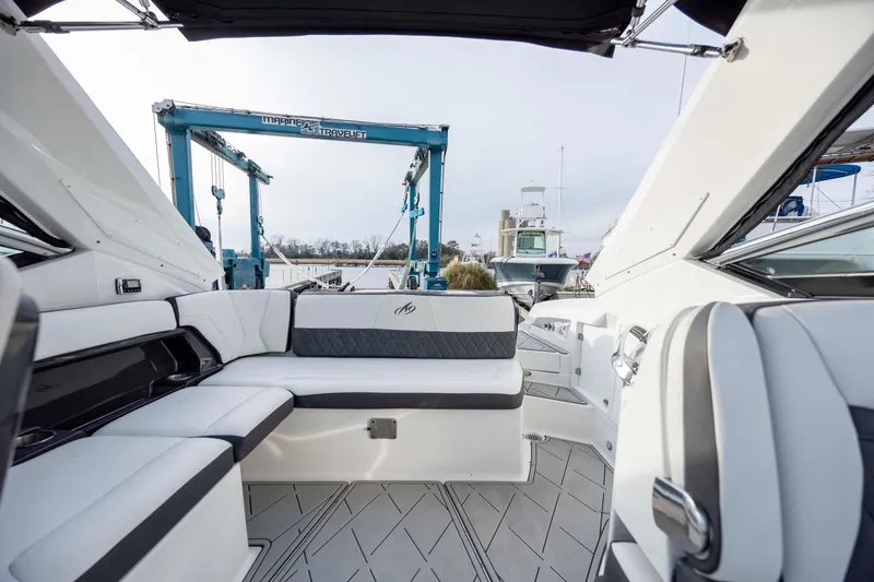Slide: The Image of 2015 Monterey 328SS Super Sport boat interior with sleek seating and modern design. - 22