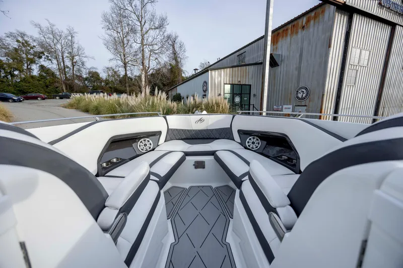 Slide: The Image of Engine compartment of a 2015 Monterey 328SS Super Sport boat, showcasing dual engines. - 31