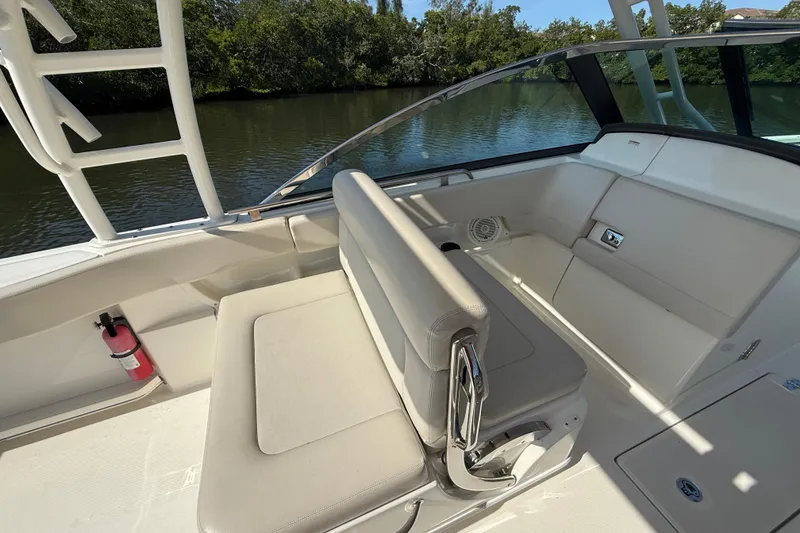 Slide: The Image of 2018 Boston Whaler 270 Vantage boat interior with seating and safety equipment. - 8