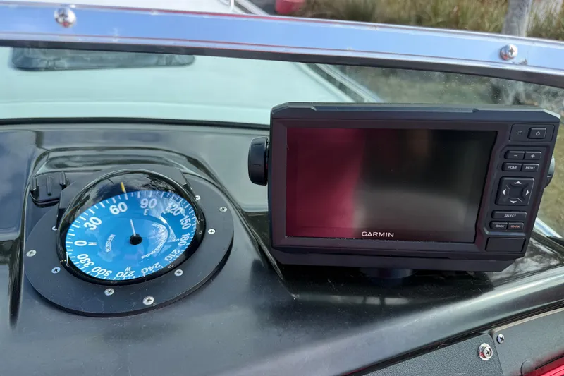 Slide: The Image of 1988 Thunderbird Formula 311 SR1 dashboard with compass and Garmin GPS device. - 27