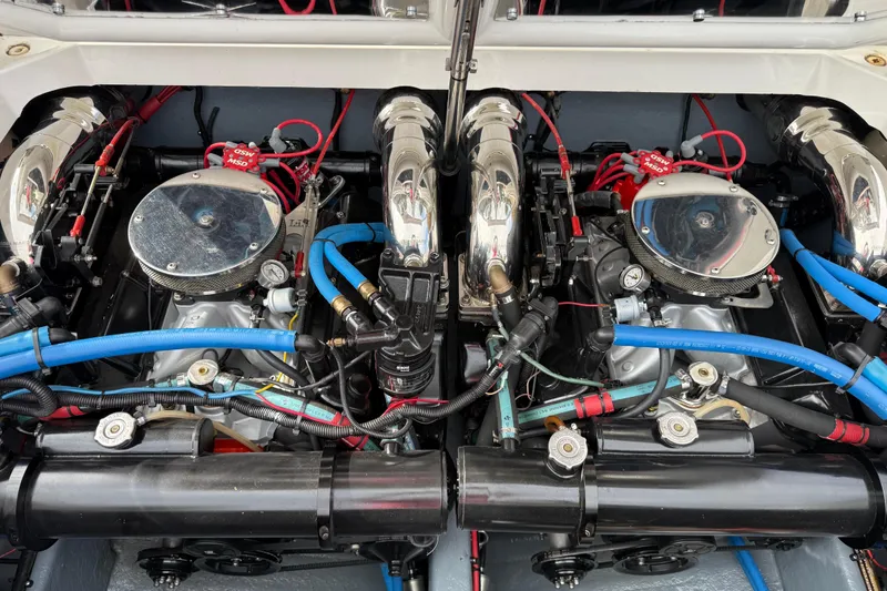 Slide: The Image of 1988 Thunderbird Formula 311 SR1 engine with chrome components and blue hoses. - 28