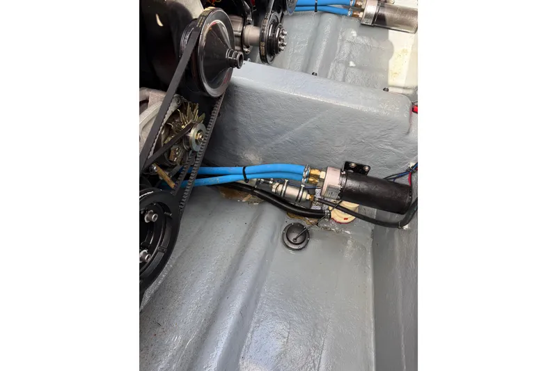 Slide: The Image of Engine compartment of a 1988 Thunderbird Formula 311 SR1 with visible belts and hoses. - 31