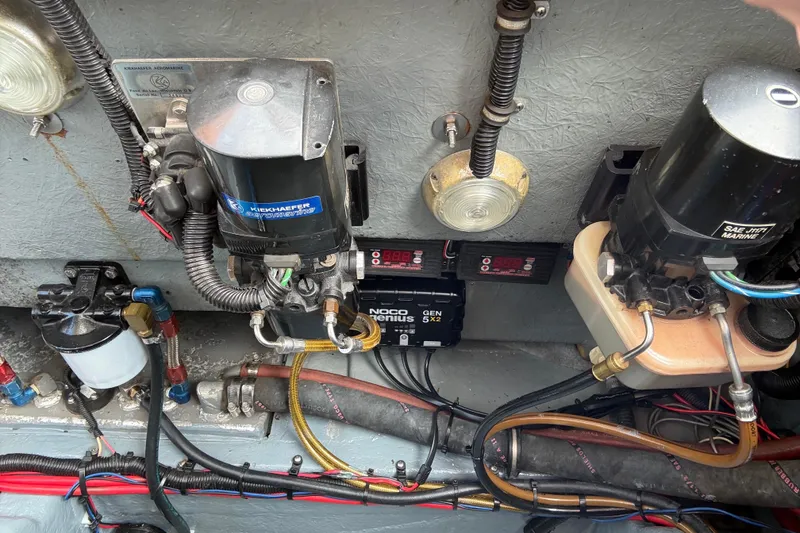 Slide: The Image of Engine compartment of a 1988 Thunderbird Formula 311 SR1 with various mechanical components. - 32