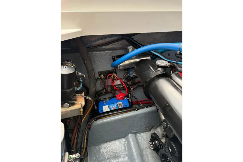 Slide: The Image of Engine compartment of 1988 Thunderbird Formula 311 SR1 with visible wiring and components. - 35