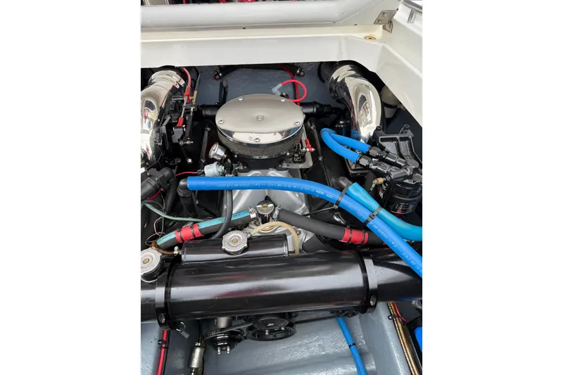 Slide: The Image of 1988 Thunderbird Formula 311 SR1 engine with blue hoses and chrome components. - 36