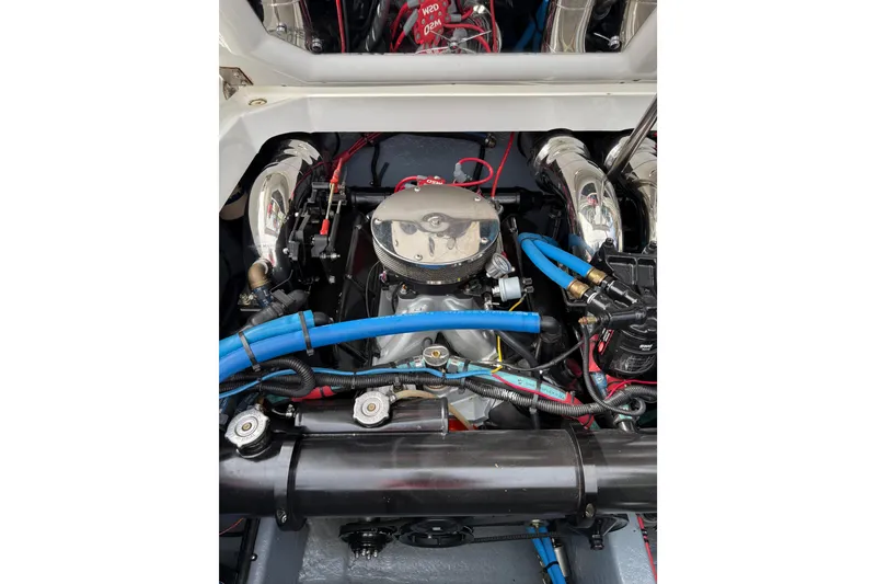 Slide: The Image of 1988 Thunderbird Formula 311 SR1 engine with chrome components and blue hoses. - 37