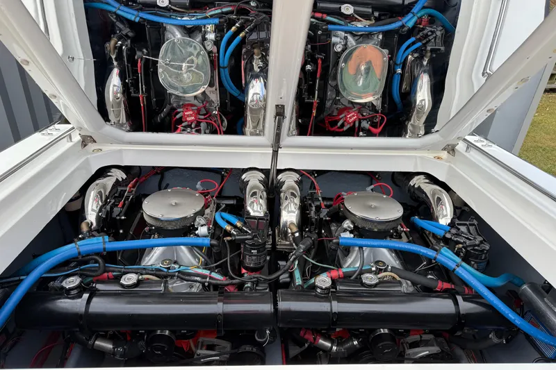 Slide: The Image of 1988 Thunderbird Formula 311 SR1 engine compartment with dual engines and blue hoses. - 39