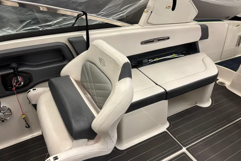 Slide: The Image of 2018 Chaparral 287 SSX boat interior with white and black seating. - 10