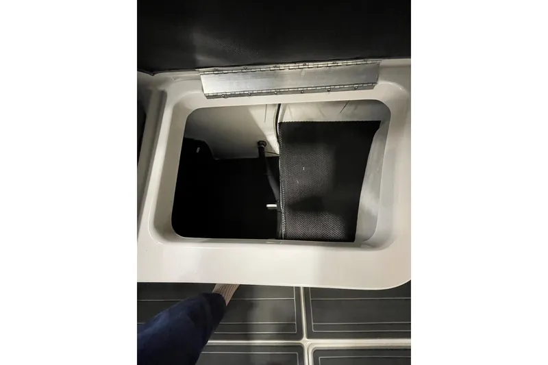 Slide: The Image of Storage compartment in 2018 Chaparral 287 SSX boat, featuring a sleek interior design. - 16
