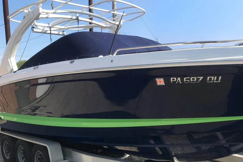 Slide: The Image of 2018 Chaparral 287 SSX boat on trailer, side view with registration number. - 6