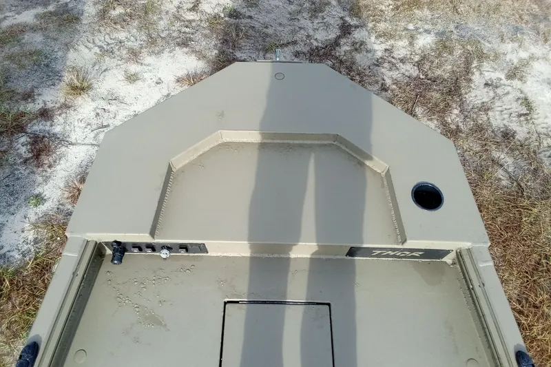 Slide: The Image of Top view of 2026 Thor 1754 Swamp Hammer boat on sandy terrain. - 11
