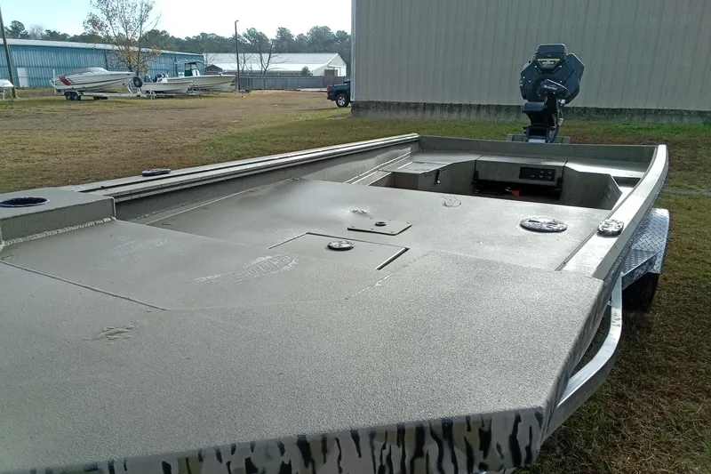 Slide: The Image of 2026 Thor 1754 Swamp Hammer boat on trailer, outdoor setting. - 17