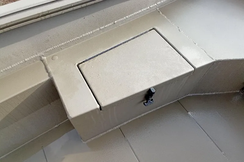 Slide: The Image of Storage compartment on a 2026 Thor 1754 Swamp Hammer boat, featuring a secure latch. - 8
