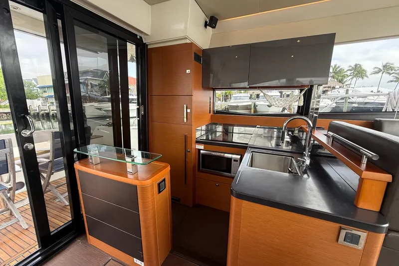 Slide: The Image of Luxurious 2017 Prestige 500S yacht kitchen with modern appliances and sleek design. - 17