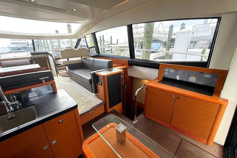 Slide: The Image of Luxurious interior of 2017 Prestige 500S yacht with modern furnishings and large windows. - 18