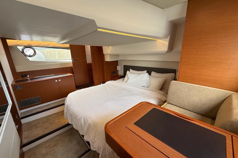 Slide: The Image of Luxurious cabin interior of 2017 Prestige 500S yacht with bed and seating area. - 25
