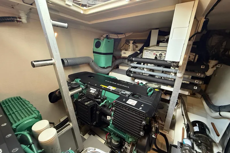 Slide: The Image of Engine room of a 2017 Prestige 500S yacht, showcasing mechanical components. - 62