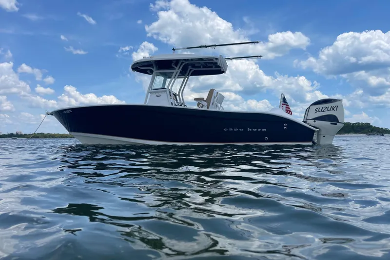 The Image of 2019 Cape Horn 27 XS boat on water, clear sky, Suzuki engine visible. - 0