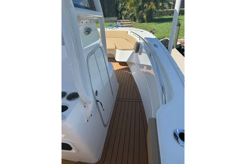 Slide: The Image of 2019 Cape Horn 27XS boat interior with teak flooring and seating area. - 12