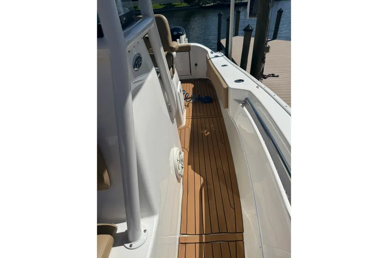 Slide: The Image of 2019 Cape Horn 27XS boat with teak deck, docked at marina. - 13