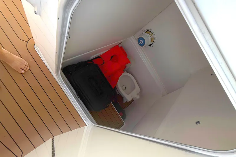 Slide: The Image of 2019 Cape Horn 27XS boat interior with head and life jackets. - 16