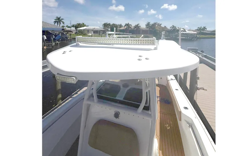 Slide: The Image of 2019 Cape Horn 27XS boat top view under clear blue sky. - 18