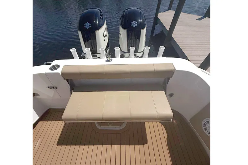 Slide: The Image of 2019 Cape Horn 27XS boat interior with seating and dual engines. - 19