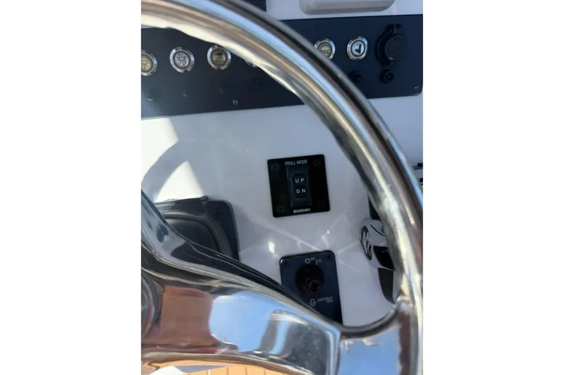Slide: The Image of Steering wheel and controls of 2019 Cape Horn 27XS boat cockpit. - 20