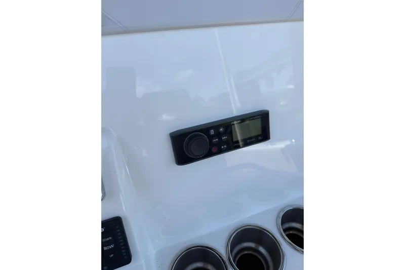 Slide: The Image of Control panel on 2019 Cape Horn 27XS boat dashboard with cup holders. - 22