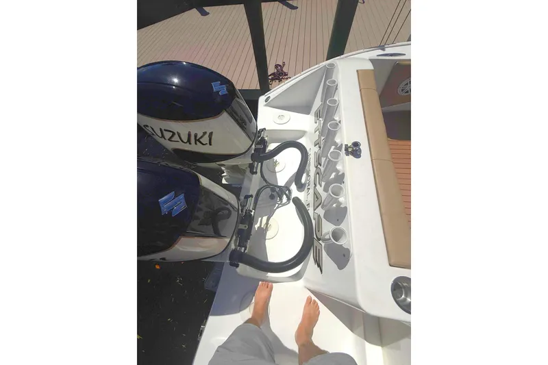 Slide: The Image of 2019 Cape Horn 27XS boat with Suzuki engines and rod holders, viewed from above. - 23