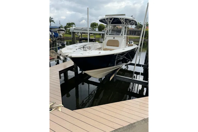 Slide: The Image of 2019 Cape Horn 27 XS boat docked at marina with overcast sky. - 26