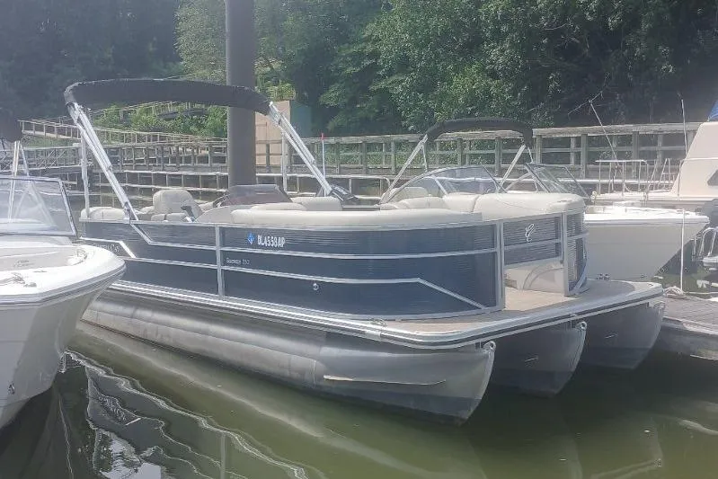 Slide: The Image of 2023 Cypress Cay Seabreeze 232 pontoon boat docked at marina. - 3