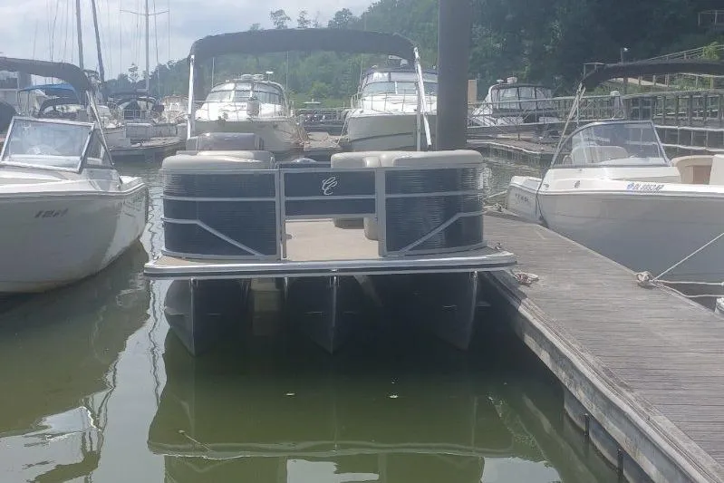 Slide: The Image of 2023 Cypress Cay Seabreeze 232 pontoon boat docked at a marina. - 4