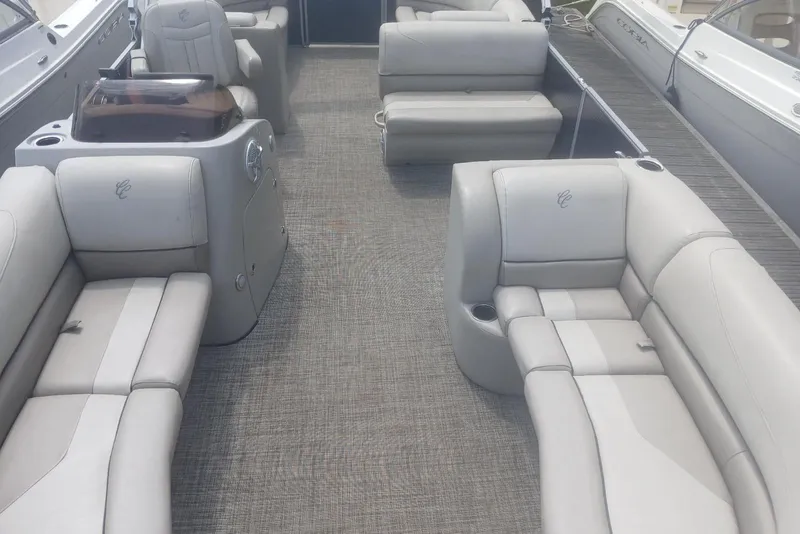 Slide: The Image of 2023 Cypress Cay Seabreeze 232 pontoon boat interior with plush seating and modern design. - 7