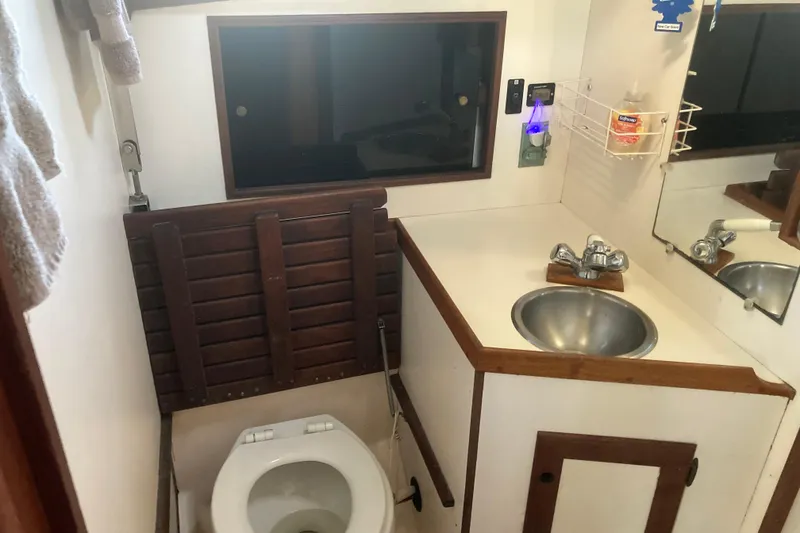 Slide: The Image of Bathroom interior of 1989 Cape Dory 300 Motorsailer with sink and toilet. - 12