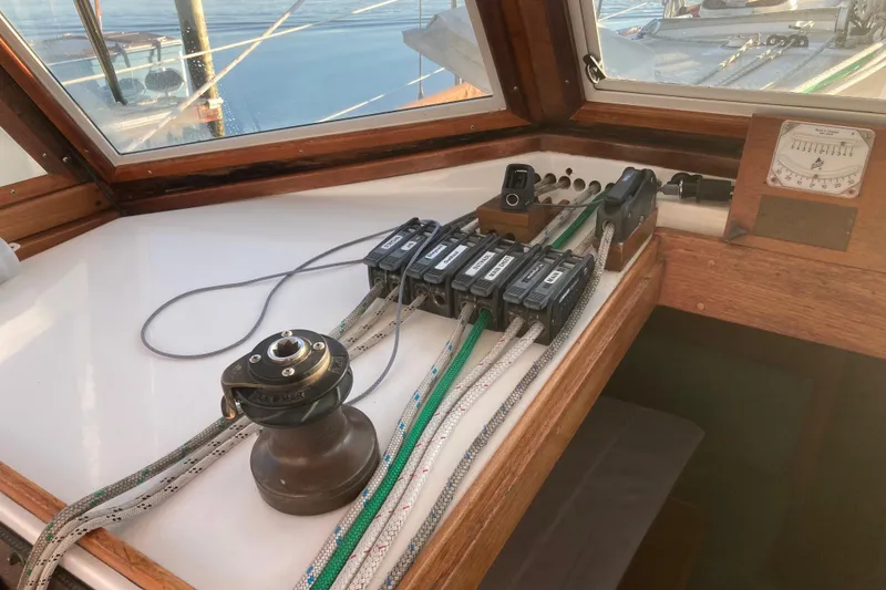 Slide: The Image of Control panel of a 1989 Cape Dory 300 Motorsailer with ropes and winch. - 14