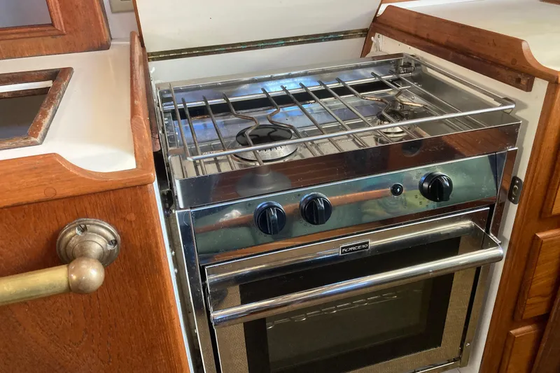 Slide: The Image of Stainless steel stove in 1989 Cape Dory 300 Motorsailer kitchen area. - 7