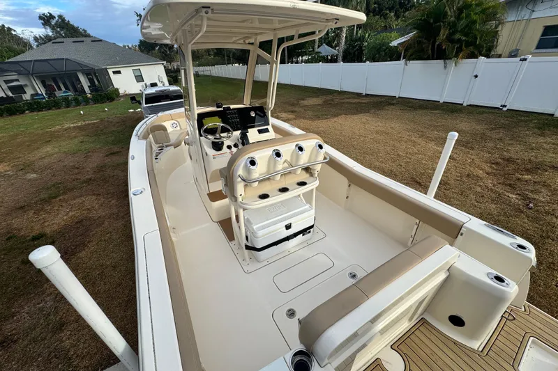 Slide: The Image of 2023 Scout 240 XSF boat with spacious deck and modern console. - 11