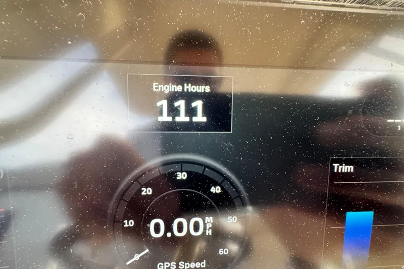 Slide: The Image of Dashboard of 2023 Scout 240 XSF showing 111 engine hours and GPS speed. - 38